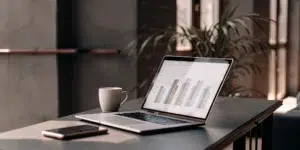 Instagram ad pricing chart on a laptop.