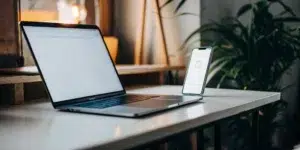 Contact SEO providers via laptop or smartphone.