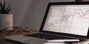 SEO performance tracking graph on a laptop.