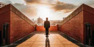 Confident professional on rooftop, symbolizing career growth.
