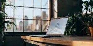 Laptop with business growth chart.