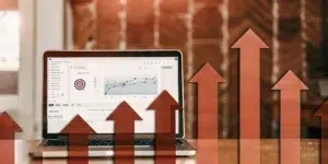 Email marketing analytics on laptop showing growth.