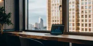 Laptop with growth chart symbolizes career advancement.