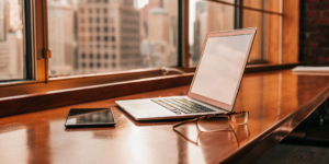 A modern workspace with a laptop used by a business adapting to the future of AI search.