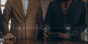 Marketers evaluating marketing channel performance with data icons for web, analytics, and email.