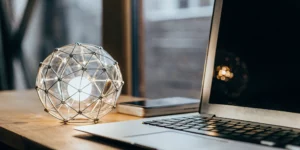 Laptop and smartphone on a desk for a business adapting its SEO for AI's final mile.