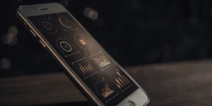 How to use KWFinder for mobile optimization shown on a smartphone screen.