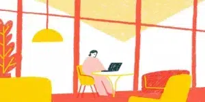 Small business owner reviewing marketing analytics on a laptop in a modern office