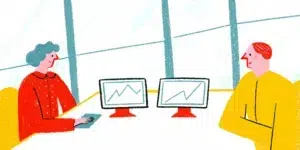 Marketing strategist and financial advisor reviewing analytics in a bright modern office